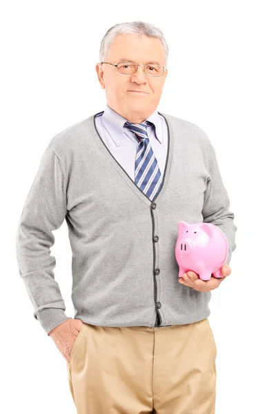 Mature man holding piggybank — Stock Photo, Image