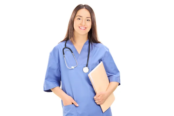 Young female doctor holding papers — Stock Photo, Image