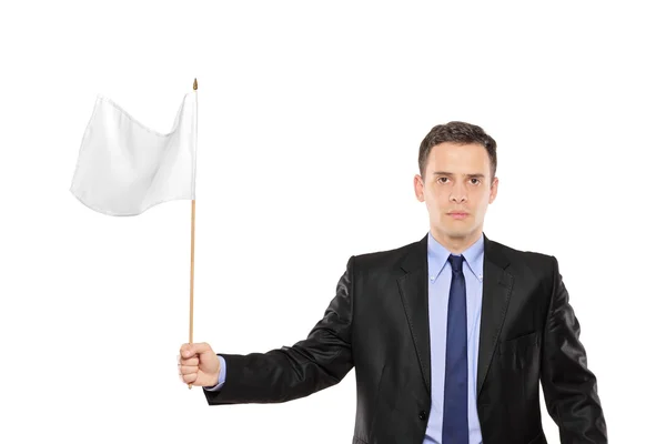 Joven empresario ondeando bandera blanca —  Fotos de Stock