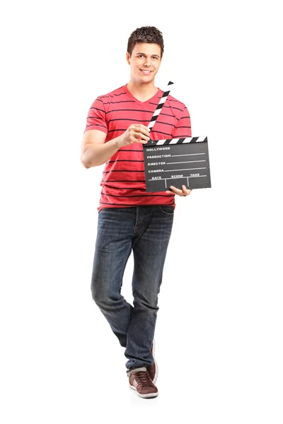 Young filmmaker holding movie-clapper — Stock Photo, Image