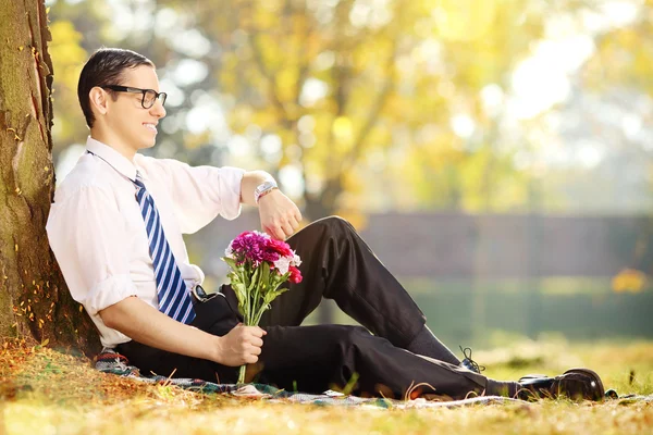 Man with bunch of flowers — Stock Photo, Image