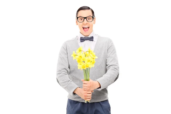 Guy holding bunch of flowers — Stock Photo, Image