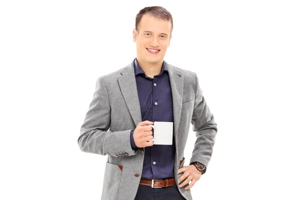 Elegante hombre sosteniendo taza de café —  Fotos de Stock