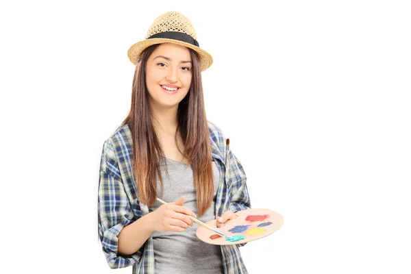 Female painter leaning against wall — Stock Photo, Image