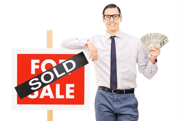 Male realtor holding money — Stock Photo, Image