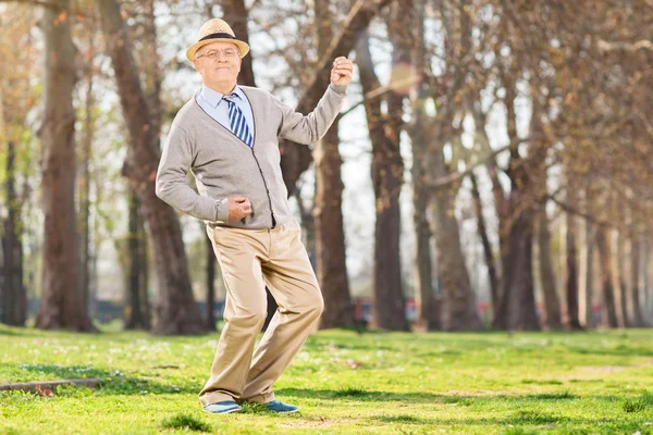 Senior man playing air guitar — Stock Photo, Image