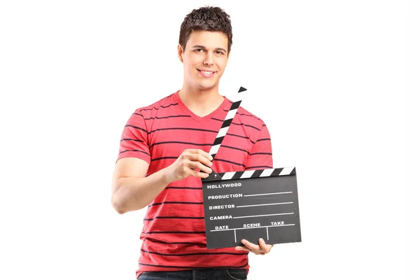 Young filmmaker holding movie-clapper — Stock Photo, Image