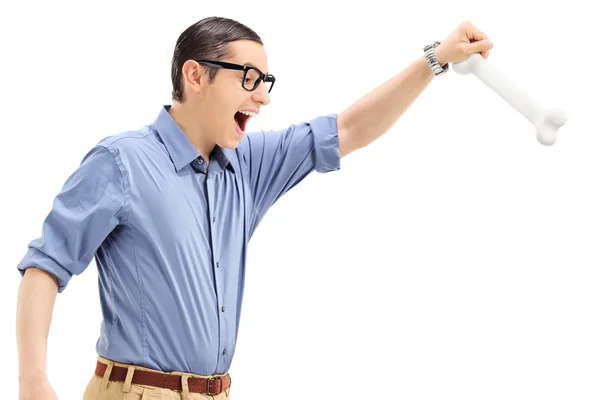 Young man holding bone — Stock Photo, Image