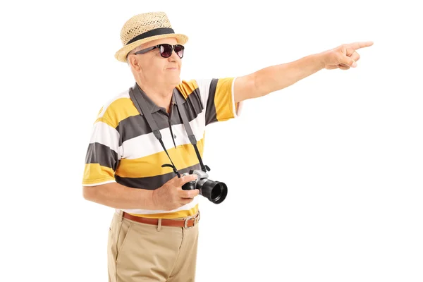 Mature tourist pointing at something — Stock Photo, Image