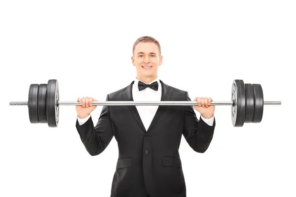 Man In suit holding barbell — Stock Photo, Image