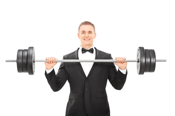 Homem de terno segurando barbell — Fotografia de Stock