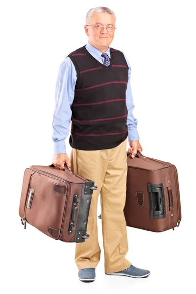 Senior gentleman carrying two bags — Stock Photo, Image