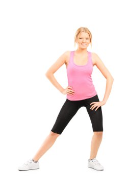 Молода дівчина, розтягуючи її стегна 