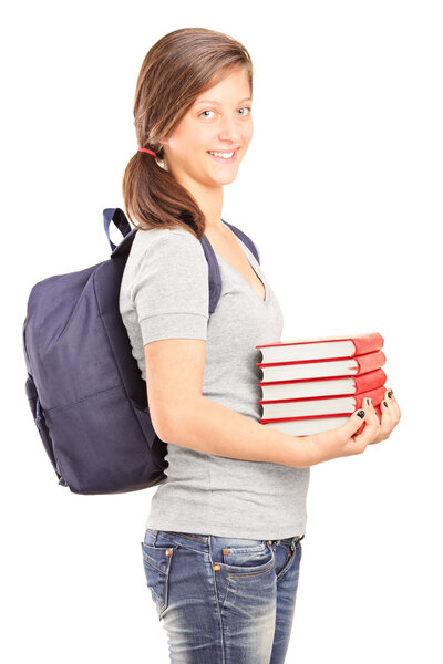 Teenage schoolgirl holding books