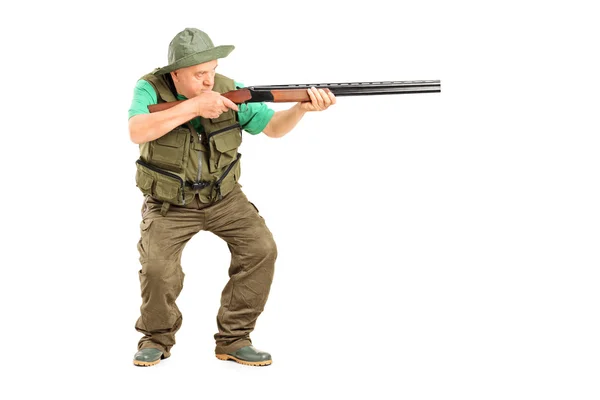 Mature hunter aiming at something — Stock Photo, Image