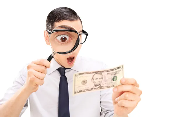 Excited man looking at dollar — Stock Photo, Image
