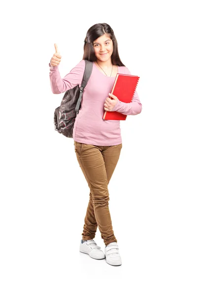 Teenage schoolgirl giving thumb up — Stock Photo, Image