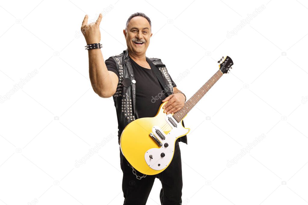 Mature rocker with an electric guitar gesturing a rock and roll sign isolated on white background
