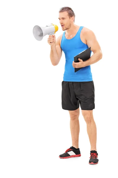 Fitness instructor shouting on megaphone — Stock Photo, Image