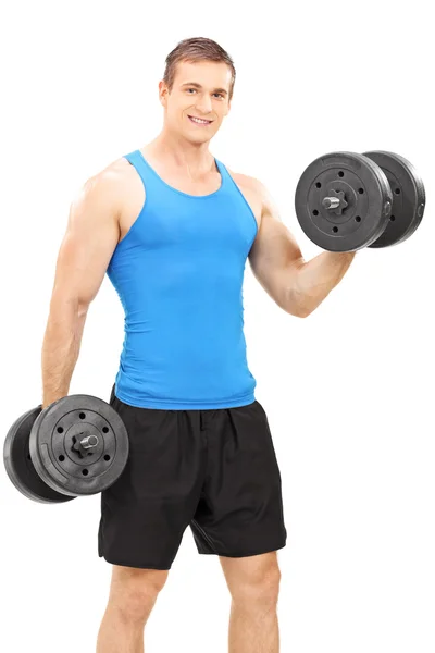 Young athlete exercising with barbells — Stock Photo, Image