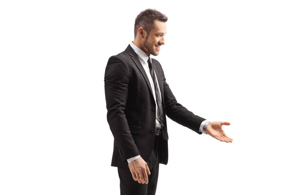 Busienssman in a suit gesturing with hand and taking something isolated on white background