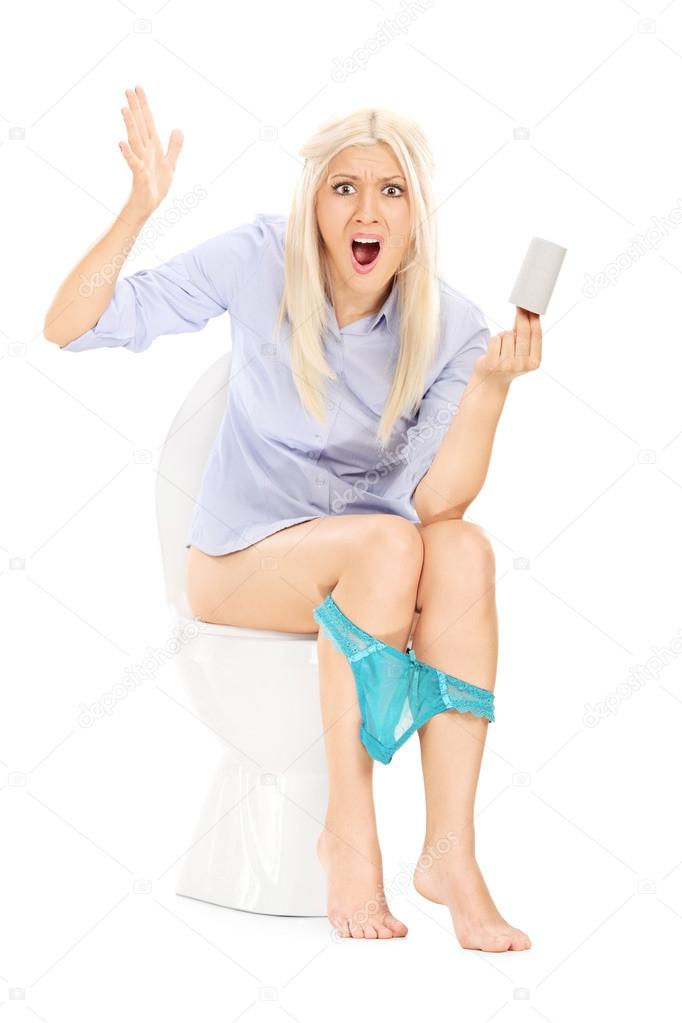Girl holding empty toilet paper roll