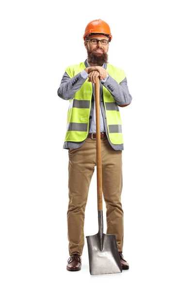 Bauingenieur Mit Weste Und Helm Stützt Sich Auf Eine Schaufel — Stockfoto
