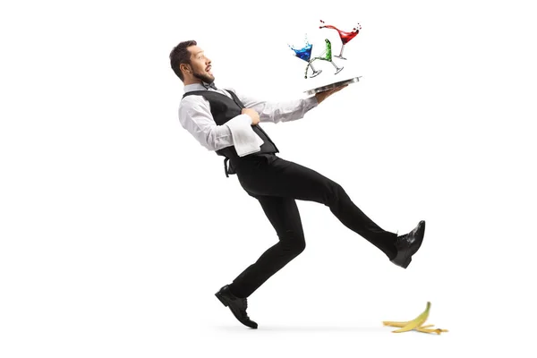 Ganztägige Aufnahme Eines Kellners Der Auf Einer Bananenschale Ausrutscht Und — Stockfoto