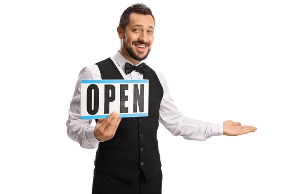 Cheerful Young Waiter Holding Sign Open Gesturing Welcome Isolated White — Stock Photo, Image