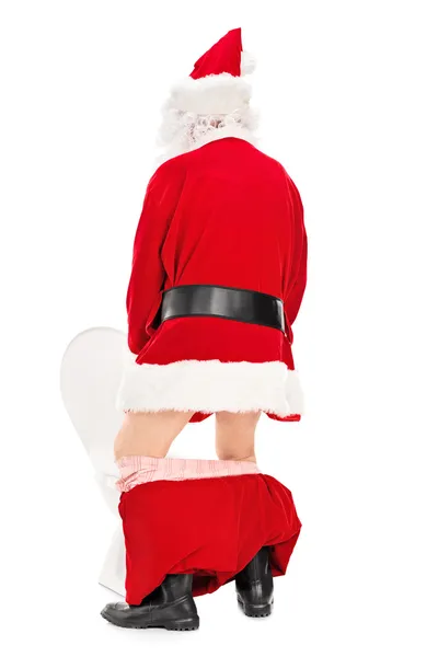 Santa claus nemen Pis — Stockfoto