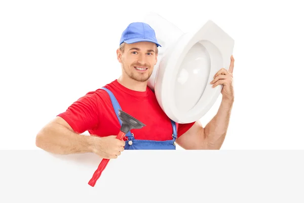 Plumber holding toilet bowl — Stock Photo, Image