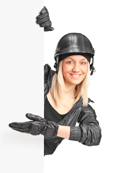 Female biker pointing on panel — Stock Photo, Image