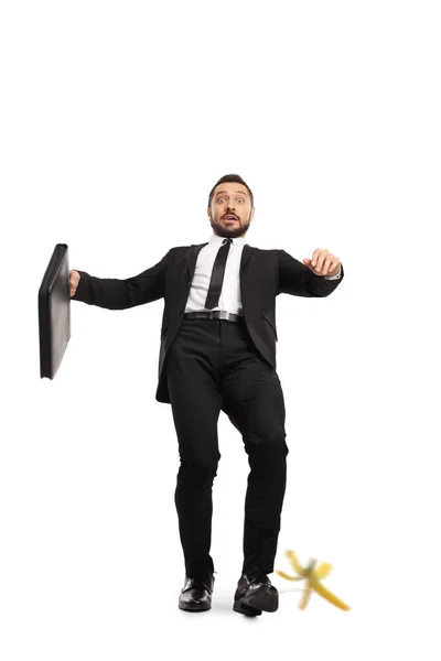 Full Length Portrait Businessman Briefcase Slipping Banana Peel Isolated White — Stock Photo, Image