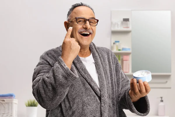 Mature Man Using Facial Cream Bathroom Home — Stock Photo, Image