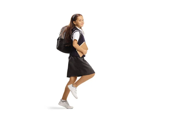 Dívka Školní Uniformě Batohem Skákání Školy Izolované Bílém Pozadí — Stock fotografie