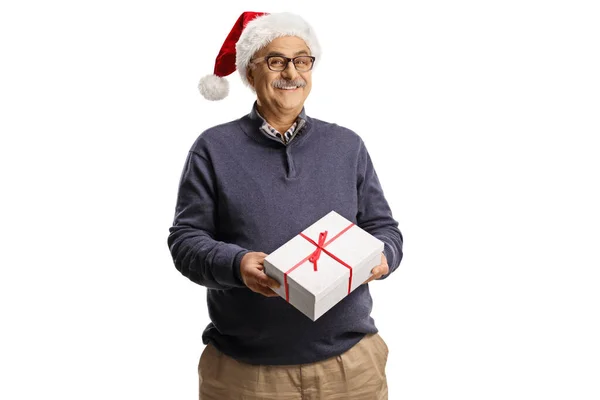 头戴圣爪帽 手持白色背景的礼品盒的成熟男人 — 图库照片