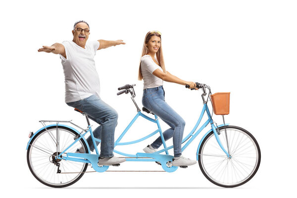 Mature man and a young female on a tandem bicycle isolated on white background