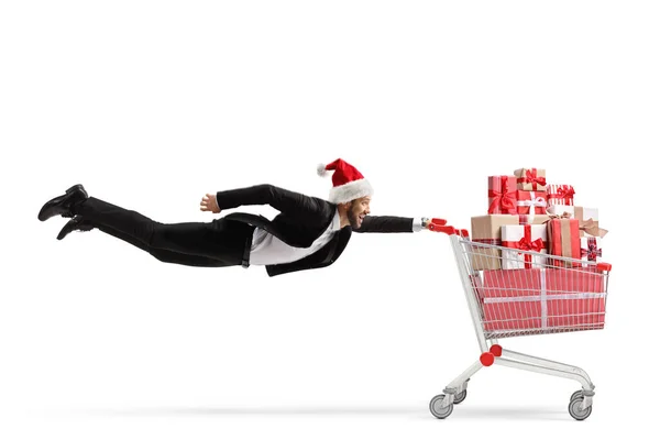 Businessman Santa Claus Hat Flying Holding Shopping Cart Full Presents — Stock Photo, Image