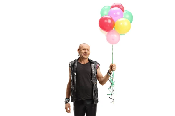Punk Man Läder Kläder Som Håller Ett Gäng Färgglada Ballonger — Stockfoto