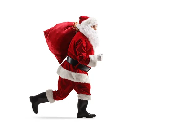 Noel Baba Nın Omzunda Bir Çuvalla Beyaz Arka Planda Koşarken — Stok fotoğraf