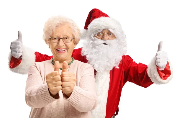 Aufgeregt Gestikuliert Der Weihnachtsmann Hinter Einer Lächelnden Älteren Frau Auf — Stockfoto