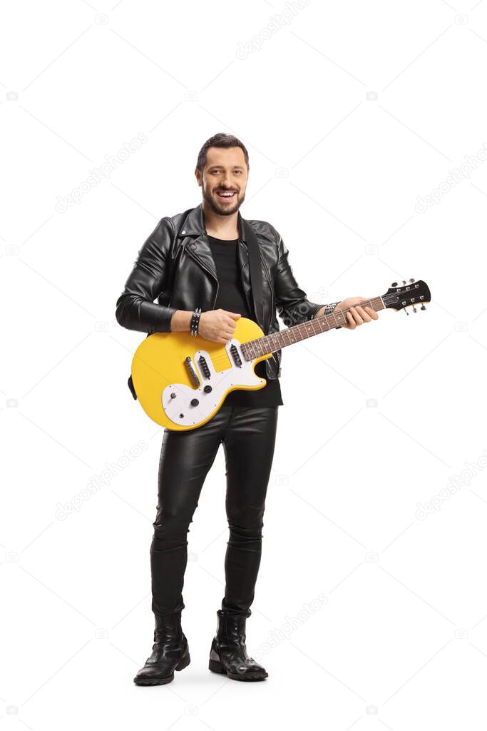 Smiling male musician with a yellow electric guitar isolated on white background 