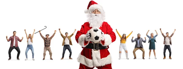 Papai Noel Segurando Uma Bola Futebol Pessoas Aplaudindo Nas Costas — Fotografia de Stock