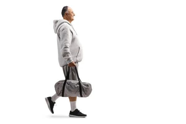 Full Length Profile Shot Mature Man Walking Carry Sports Bag — Zdjęcie stockowe