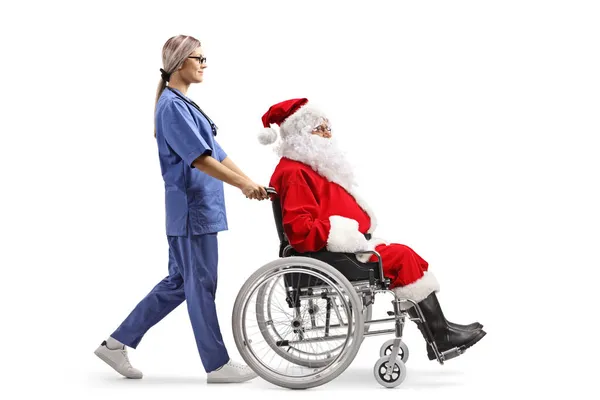 Foto Perfil Completo Una Enfermera Caminando Empujando Santa Claus Una — Foto de Stock