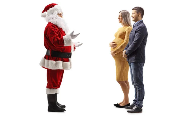 Полнометражный Снимок Разговора Санта Клауса Беременной Женщиной Мужем Изолированным Белом — стоковое фото