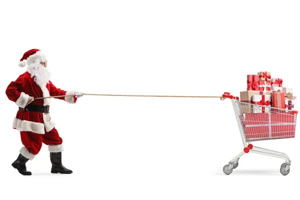 圣诞老人拉着一辆装有礼物的购物车 车上的绳子与白色背景隔离 — 图库照片