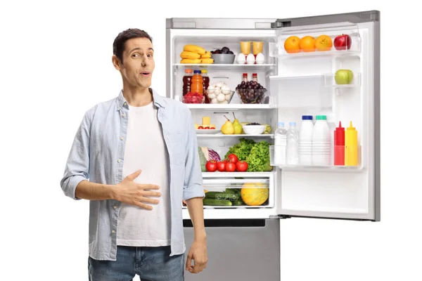 Young Man Holding His Hand His Stomach Front Open Fridge — Stock Photo, Image