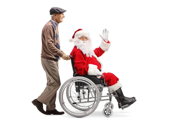 Imagen Perfil Completo Anciano Empujando Santa Claus Una Silla Ruedas — Foto de Stock