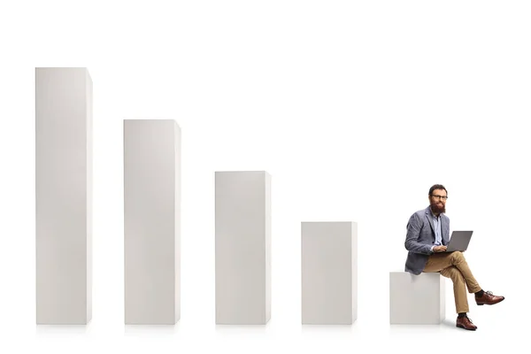 Man Laptop Computer Sitting Lowest Column Graph Chart Isolated White — Stock Photo, Image